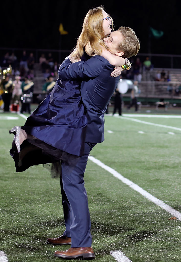 Ethan Hayes spins senior and cheerleader Sydney Kent after she won Homecoming Queen